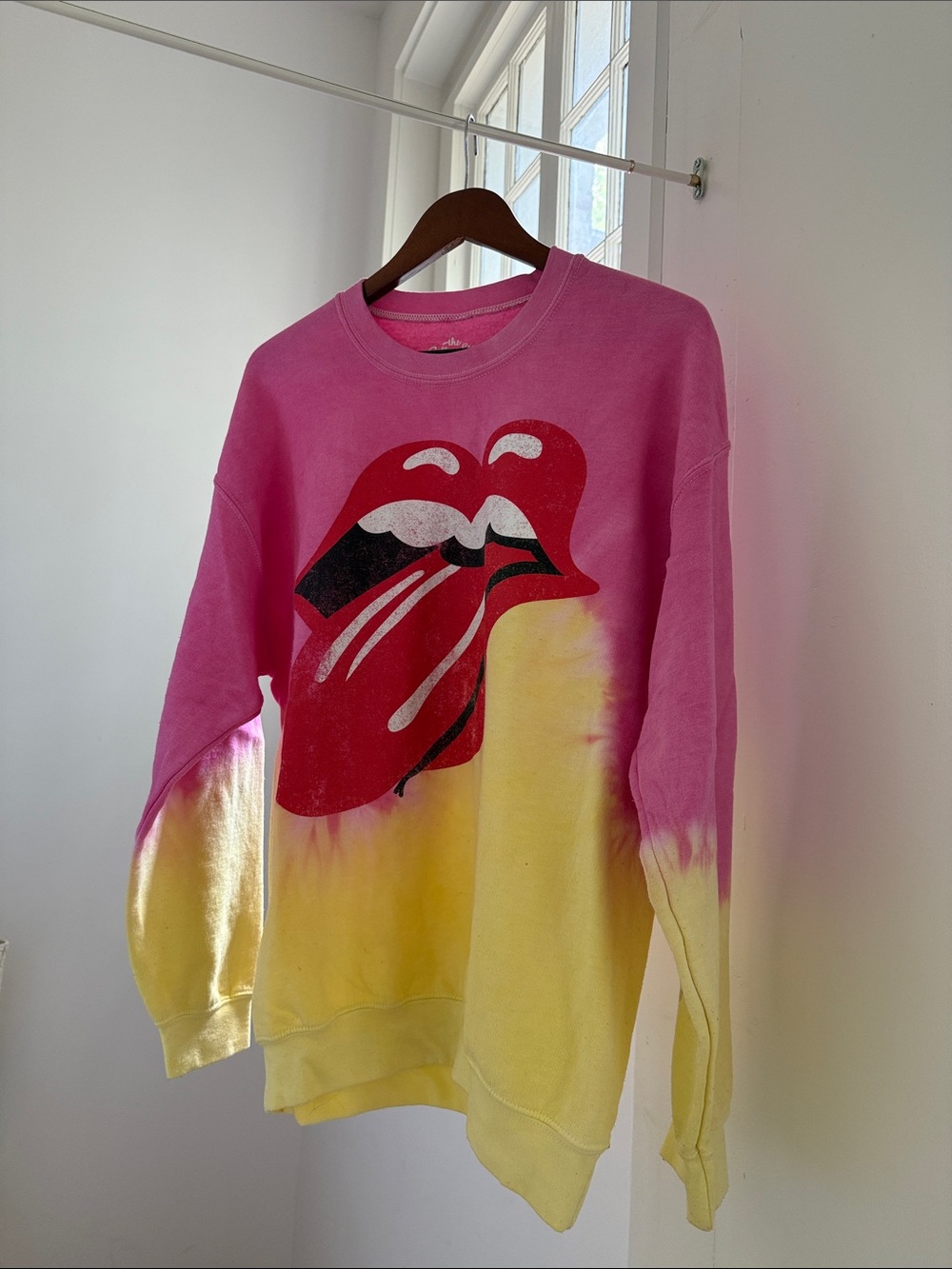 the Rolling Stones Pink and Yellow Tie-Dye Crewneck with Red Tongue Logo